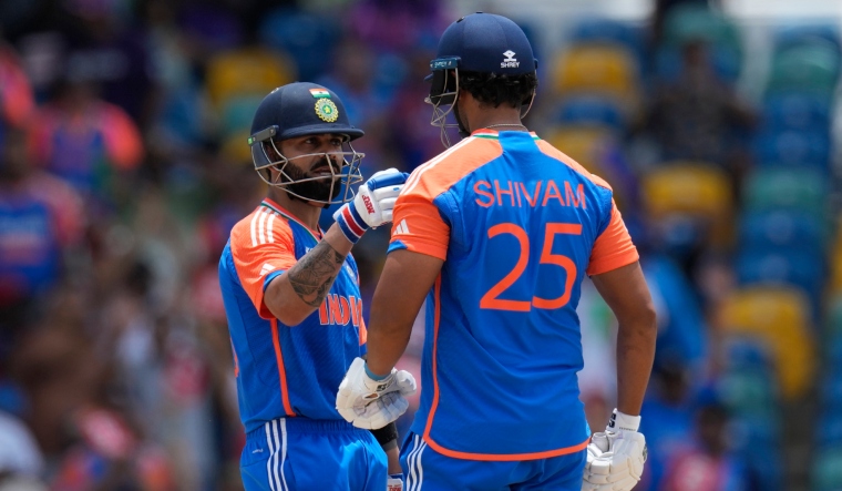 Virat Kohli speaks to batting partner Shivam Dube during the ICC Men's T20 World Cup final | AP